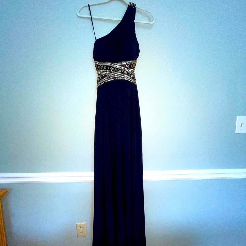 Long navy blue dress; open back; gold detailing